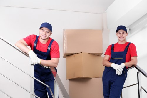 Packing boxes and wrapping household items for a move in Mottingham
